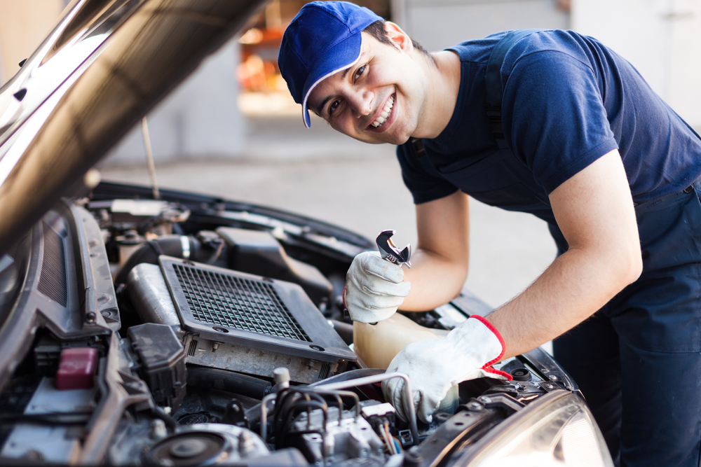 Mechanic working on a car engine