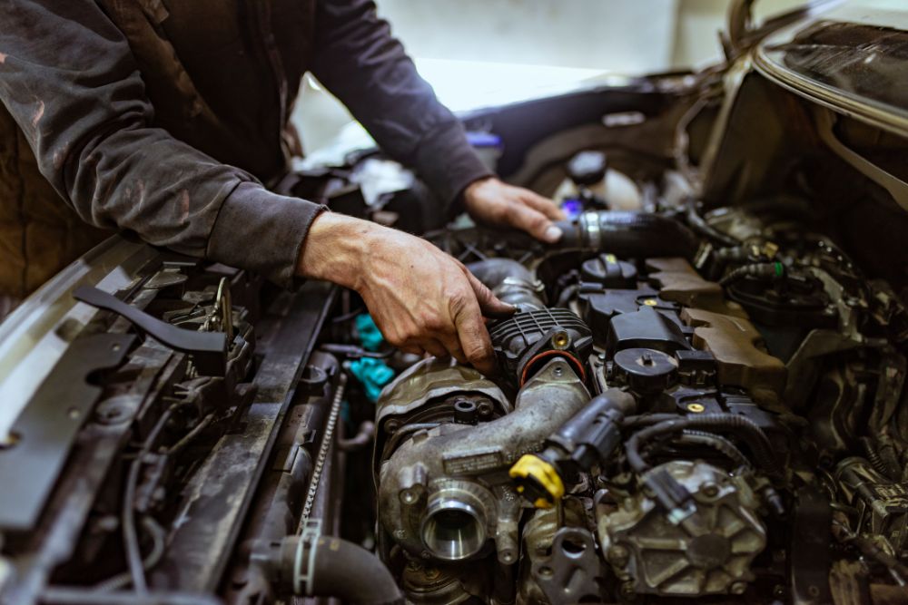 Auto mechanic fixing engine