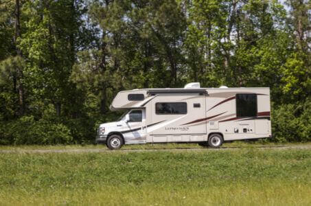 motorhome driving along a roadside during an RV trip