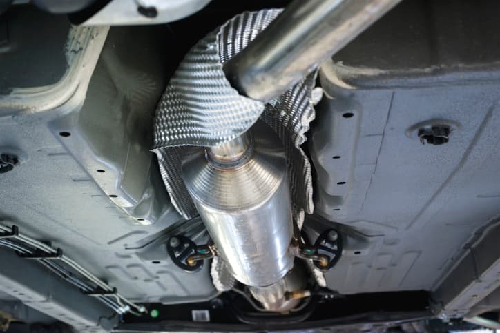 Undercarriage view of a vehicle exhaust system and catalytic converter